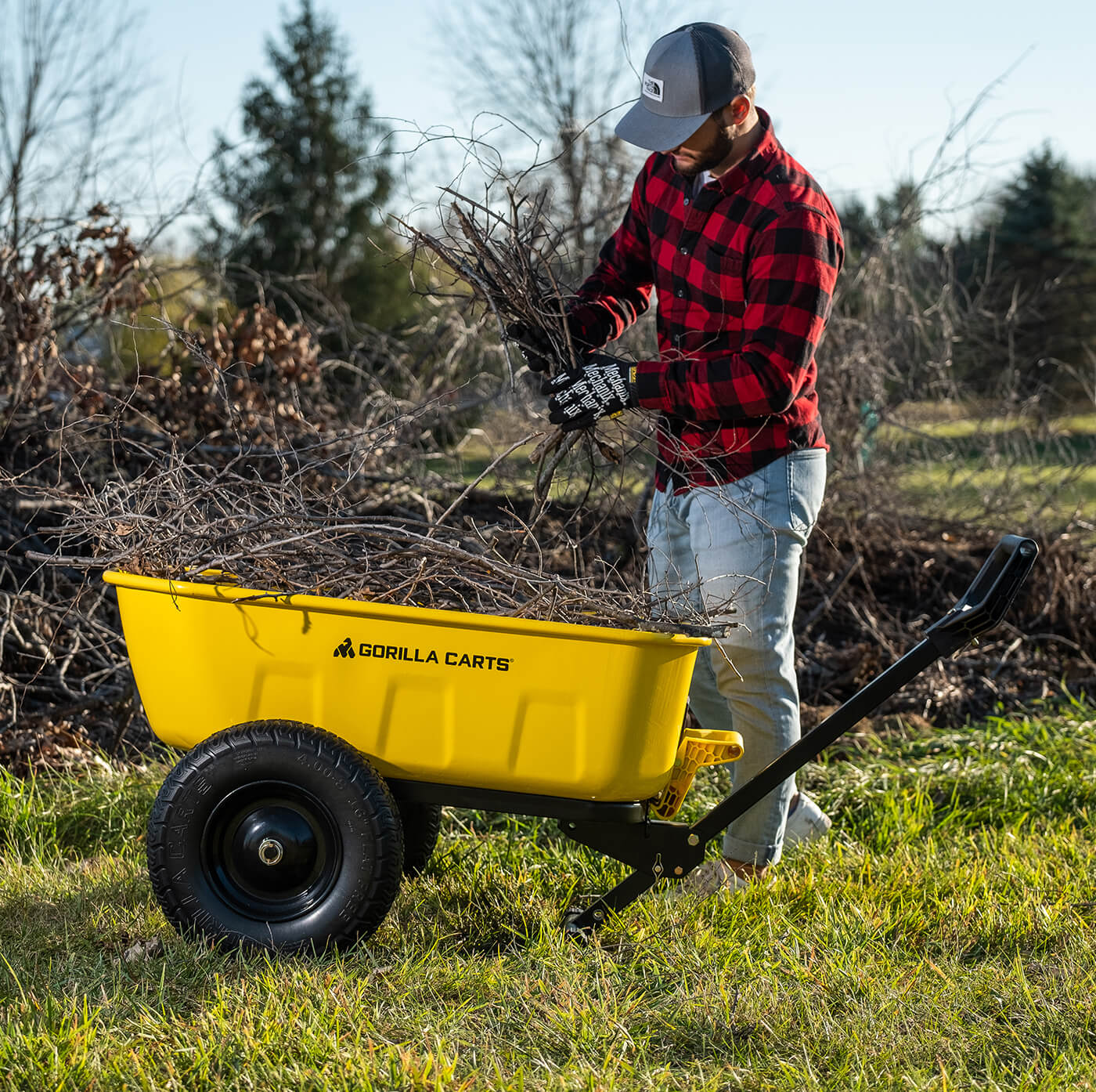 Man placing branches in a GCPT-8-C